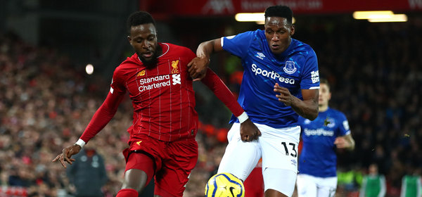 LIVERPOOL, ENGLAND - DECEMBER 04: Divock Origi of Liverpool battles for possession with Yerry Mina of Everton during the Premier League match between Liverpool FC and Everton FC at Anfield on December 04, 2019 in Liverpool, United Kingdom. (Photo by Clive Brunskill/Getty Images)