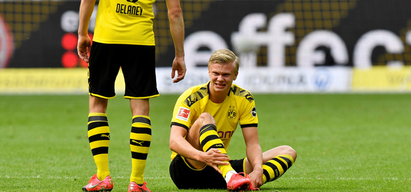 Soccer Football - Bundesliga - Borussia Dortmund v Schalke 04 - Signal Iduna Park, Dortmund, Germany - May 16, 2020 Dortmund's Erling Braut Haaland down injured, as play resumes behind closed doors following the outbreak of the coronavirus disease (COVID-19) Martin Meissner/Pool via REUTERS  DFL regulations prohibit any use of photographs as image sequences and/or quasi-video
