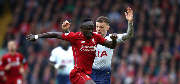 LIVERPOOL, ENGLAND - MARCH 31: Saido Mane of Liverpool is tackled by Kieran Trippier of Tottenham Hotspur  during the Premier League match between Liverpool FC and Tottenham Hotspur at Anfield on March 31, 2019 in Liverpool, United Kingdom. (Photo by Clive Brunskill/Getty Images)