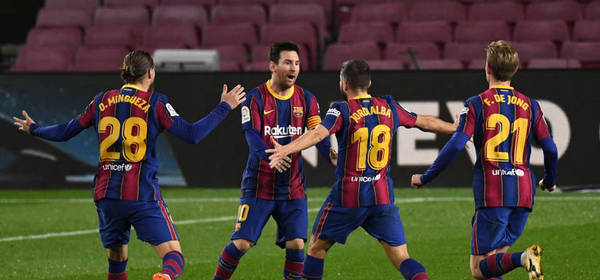 BARCELONA, SPAIN - DECEMBER 16: Jordi Alba of Barcelona  celebrates after scoring their team's first goal with Oscar Mingueza, Lionel Messi, and Frenkie de Jong of Barcelona  during the La Liga Santander match between FC Barcelona and Real Sociedad at Camp Nou on December 16, 2020 in Barcelona, Spain. Sporting stadiums around Spain remain under strict restrictions due to the Coronavirus Pandemic as Government social distancing laws prohibit fans inside venues resulting in games being played behind closed doors. (Photo by David Ramos/Getty Images)