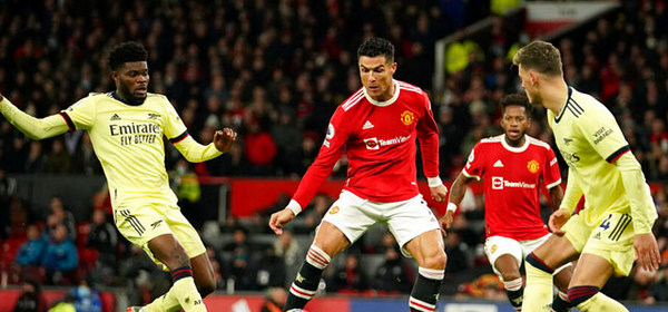 Manchester United's Cristiano Ronaldo scores his side's second goal during the English Premier League soccer match between Manchester United and Arsenal at Old Trafford stadium in Manchester, England, Thursday, Dec. 2, 2021. (AP Photo/Dave Thompson)