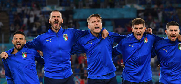 ROME, ITALY - JUNE 16: Players of Italy sing the national anthem prior to the UEFA Euro 2020 Championship Group A match between Italy and Switzerland at Olimpico Stadium on June 16, 2021 in Rome, Italy. (Photo by Claudio Villa/Getty Images)