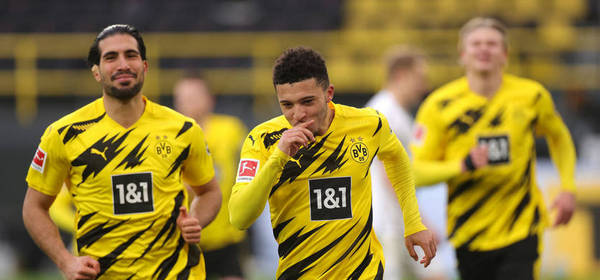 DORTMUND, GERMANY - FEBRUARY 27: Jadon Sancho of Borussia Dortmund celebrates after scoring their side's second goal from the penalty spot during the Bundesliga match between Borussia Dortmund and DSC Arminia Bielefeld at Signal Iduna Park on February 27, 2021 in Dortmund, Germany. Sporting stadiums around Germany remain under strict restrictions due to the Coronavirus Pandemic as Government social distancing laws prohibit fans inside venues resulting in games being played behind closed doors. (Photo by Friedemann Vogel - Pool/Getty Images)