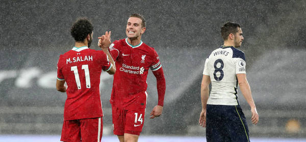 LONDON, ENGLAND - JANUARY 28: Mohamed Salah of Liverpool shakes hands with Jordan Henderson of Liverpool after the Premier League match between Tottenham Hotspur and Liverpool at Tottenham Hotspur Stadium on January 28, 2021 in London, England. Sporting stadiums around the UK remain under strict restrictions due to the Coronavirus Pandemic as Government social distancing laws prohibit fans inside venues resulting in games being played behind closed doors. (Photo by Nick Potts - Pool/Getty Images)