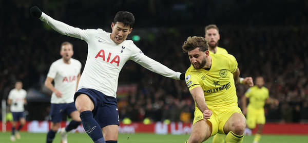 LONDON, ENGLAND - DECEMBER 02:  Charlie Goode of Brentford battles with Heung-Min Son of Spurs during the Premier League match between Tottenham Hotspur  and  Brentford at Tottenham Hotspur Stadium on December 02, 2021 in London, England. (Photo by Julian Finney/Getty Images)