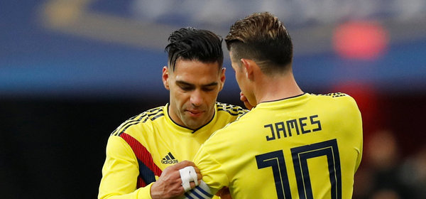 Soccer Football - International Friendly - France vs Colombia - Stade De France, Saint-Denis, France - March 23, 2018   Colombia’s Radamel Falcao passes the captain's armband to James Rodriguez before he is substituted   REUTERS/Gonzalo Fuentes