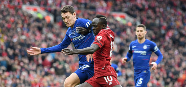 LIVERPOOL, ENGLAND - APRIL 14:  Sadio Mane of Liverpool battles with Andreas Christiansen of Chelsea during the Premier League match between Liverpool FC and Chelsea FC at Anfield on April 14, 2019 in Liverpool, United Kingdom. (Photo by Michael Regan/Getty Images)