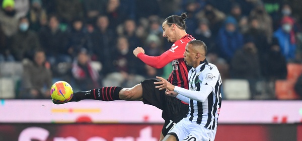 Soccer Football - Serie A - Udinese v AC Milan - Dacia Arena, Udine, Italy - December 11, 2021 AC Milan's Zlatan Ibrahimovic shoots at goal as Udinese's Rodrigo Becao looks on REUTERS/Daniele Mascolo